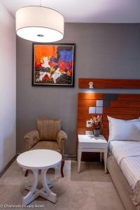 Letto o letti in una camera di Charleson Luxury Hotel