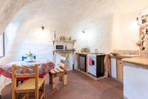 a kitchen with a table and a table and a stove at Casa circular in San Carlos de Bariloche +50 photos