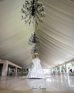 a woman in a wedding dress in a tent at Club Campestre El Eden in Yautepec de Zaragoza