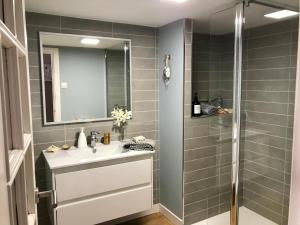 a bathroom with a sink and a shower at Casa A Codela in Combarro +41 photos