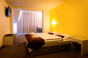 TV a/nebo společenská místnost v ubytování Hotel OSTREDOK