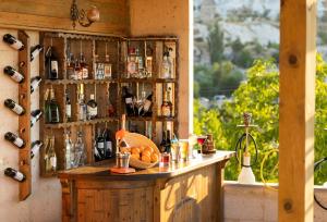 a bar with bottles of alcohol on a wall at Lord of Cappadocia Hotel in Göreme