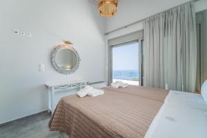 A bed or beds in a room at Owl Villas