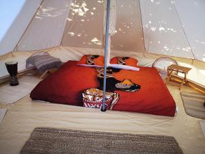 a tent with two beds in it at Luna Glamping in Tuzla