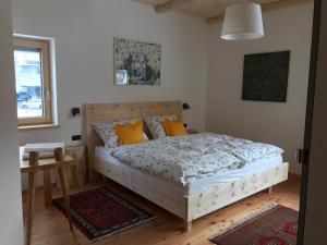 A bed or beds in a room at Cësa Gredine