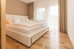 Postel nebo postele na pokoji v ubytování Villa Gloria Rooms & Apartments