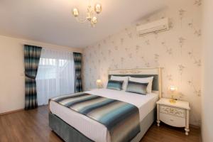 Krevet ili kreveti u jedinici u okviru objekta Onix Apart Hotel