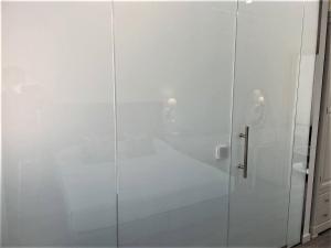 Кровать или кровати в номере Hotel Malaga Picasso