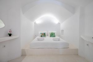 En eller flere senger på et rom på Fertimo Suites