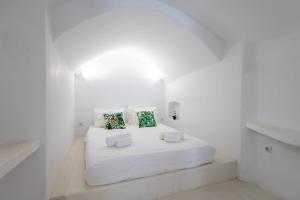 En eller flere senger på et rom på Fertimo Suites