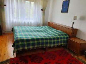 A bed or beds in a room at Apartman Draga