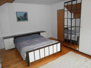 A bed or beds in a room at Apartman Draga