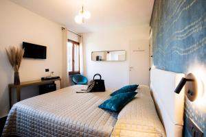 Posteľ alebo postele v izbe v ubytovaní Bellevue - Rooms & Suites