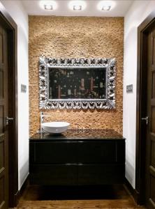 a bathroom with a sink on a brick wall at VELASCO JAUREGIA-SIERRA DE SUEÑOS in Orduña