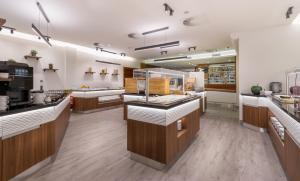 a large kitchen with wooden counter tops and appliances at City Hotel Stockerau in Stockerau
