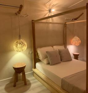 Säng eller sängar i ett rum på Thari Fushi Luxury Maldivian Experience - All Inclusive