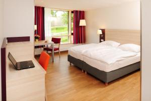 
Ein Bett oder Betten in einem Zimmer der Unterkunft Haus Insel Reichenau
