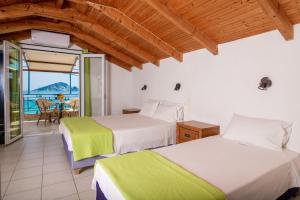 Postel nebo postele na pokoji v ubytování SeaSide Apartments + 37 fotografií