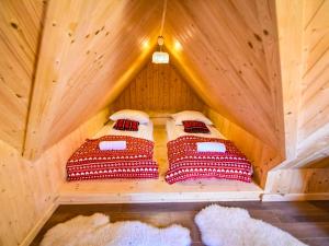 a bedroom with two beds in a tree house at Villa Szymoszkowa SKI in Kościelisko