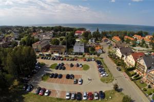 an aerial view of a parking lot with cars at Korwin in Rewal