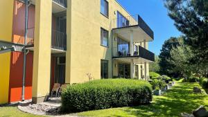 a building with a bush in front of it at Haus 54 in Zingst