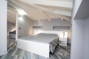 Katil atau katil-katil dalam bilik di La Dimora sul Mare