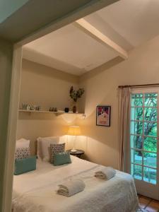 a bedroom with a large bed and a window at The Garden Room in Villamblard +58 photos