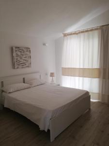 Postel nebo postele na pokoji v ubytování Domo Green House