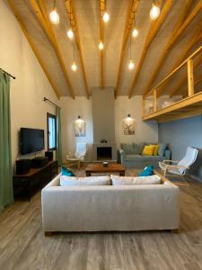 a living room with a couch and a table at Ktima Papadimitriou in Ioannina