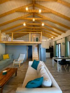 a living room with a couch and a table at Ktima Papadimitriou in Ioannina