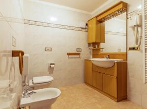Kúpeľňa v ubytovaní Hotel Des Alpes + 37 fotografií