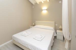 Postel nebo postele na pokoji v ubytování Agriturismo Cascina Carai