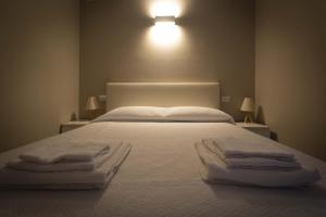 Postel nebo postele na pokoji v ubytování Agriturismo Cascina Carai