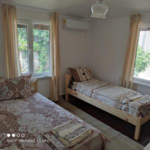 Postel nebo postele na pokoji v ubytování Mercury Guest House