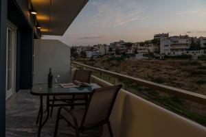 Balkón nebo terasa v ubytování CHROMA Lodge Rafina