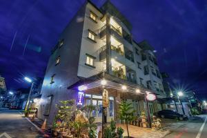 a tall building with a clock on the side of it at Ruisui Style B&B in Ruisui