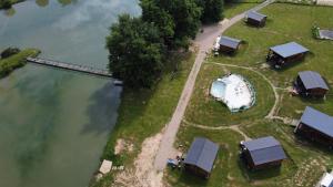 an aerial view of a small house and a boat at Studio Domaine du vieux chêne in Bergerac