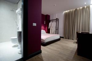 Postel nebo postele na pokoji v ubytování Mergan Hotel