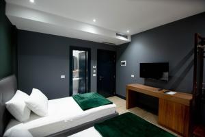 Postel nebo postele na pokoji v ubytování Mergan Hotel