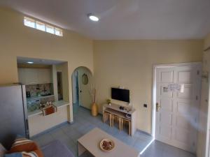 Televízia a/alebo spoločenská miestnosť v ubytovaní Tisalaya Park stay, cosy apartment in Maspalomas