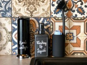 a close up of two bottles sitting on a sink at Coral Cabins in Dunvegan