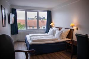 Hotel Phønix Hjørring 객실 침대