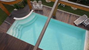 The swimming pool at or close to Residence Rivachiara (check-in at Hotel Riviera in Viale Rovereto, 95)