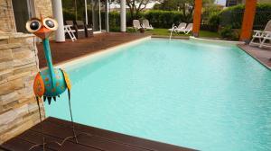 The swimming pool at or close to Residence Rivachiara (check-in at Hotel Riviera in Viale Rovereto, 95)