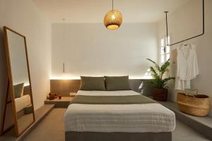 Ліжко або ліжка в номері Symmetry Suites