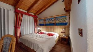 Łóżko lub łóżka w pokoju w obiekcie Hotel Selva