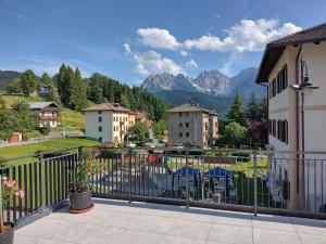 a balcony with a view of the mountains at Hotel Da Marco in Vigo di Cadore