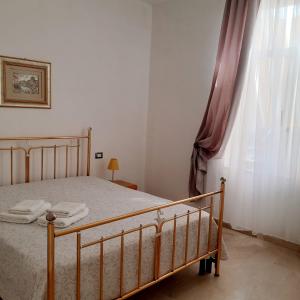 Ένα ή περισσότερα κρεβάτια σε δωμάτιο στο Appartamenti Cavataio 1