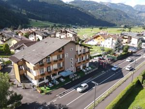 an aerial view of a small town in a mountain village at Liz Hotel & Apartments in Predazzo