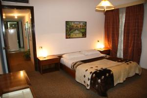 Voodi või voodid majutusasutuse Royal Maadi Hotel toas